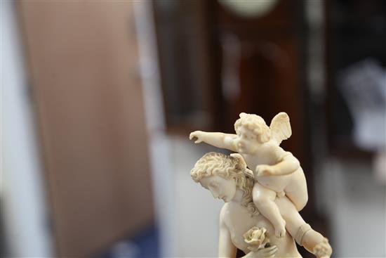 A 19th century French Dieppe ivory carving of Venus and Cupid, Overall H.13.25in.